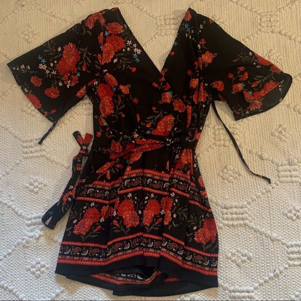Trixxi Black Floral Wrap Romper with Red & Green Accents